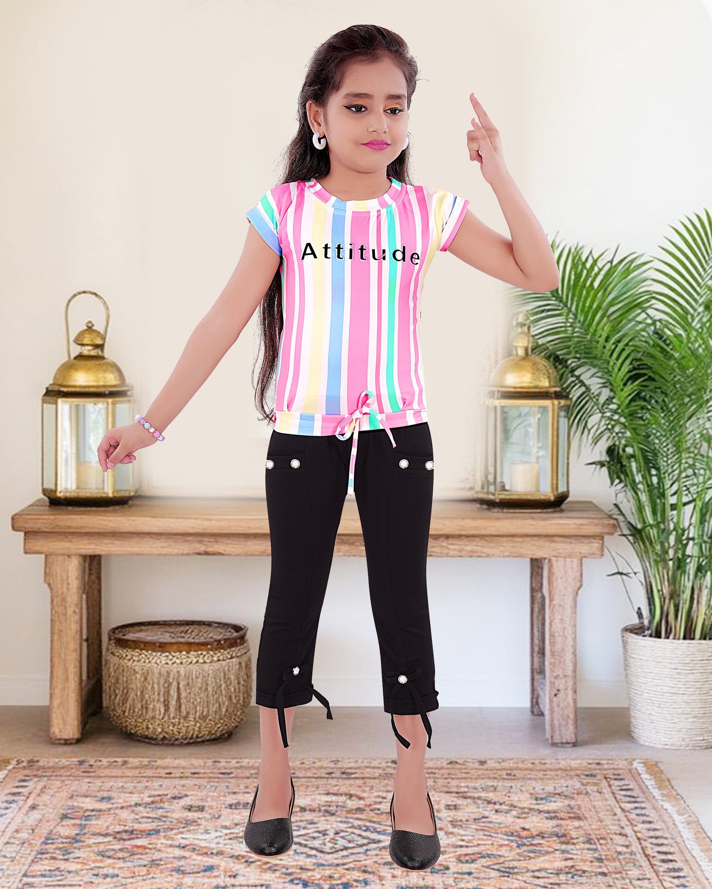 Multi Colored Top With Black Cotton Blend Bottom For Girls.