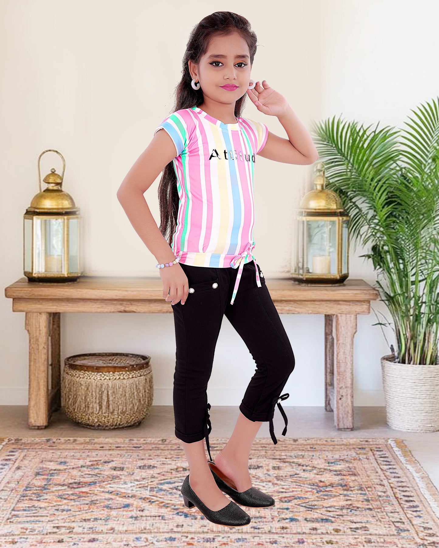 Multi Colored Top With Black Cotton Blend Bottom For Girls.