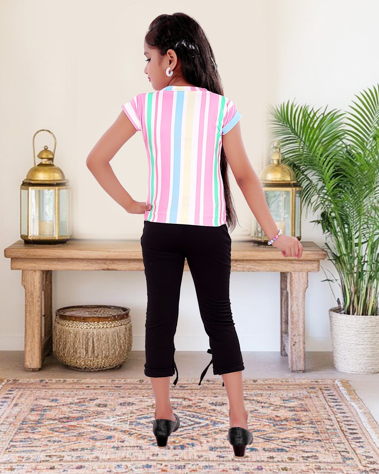 Multi Colored Top With Black Cotton Blend Bottom For Girls.